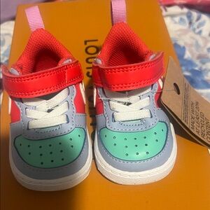 Nike Kids Sneakers in Red, Blue, and Green